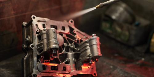 Sandblasting of an automotive industrial metal part