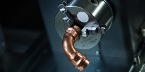 Copper plumbing part in dot-peen rotary device for impact marking machine