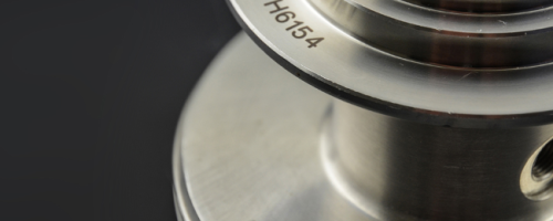 Cylindrical metal part with multi-level laser marking of a datamatrix code