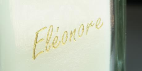 Close up of a glass engraving filled with gold gilding wax