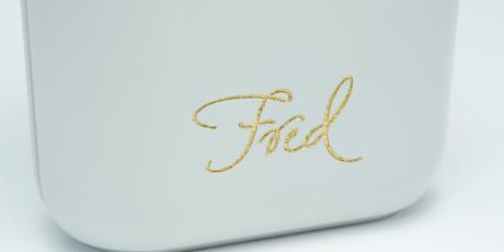 Close up of a plastic engraving filled with gold gilding wax